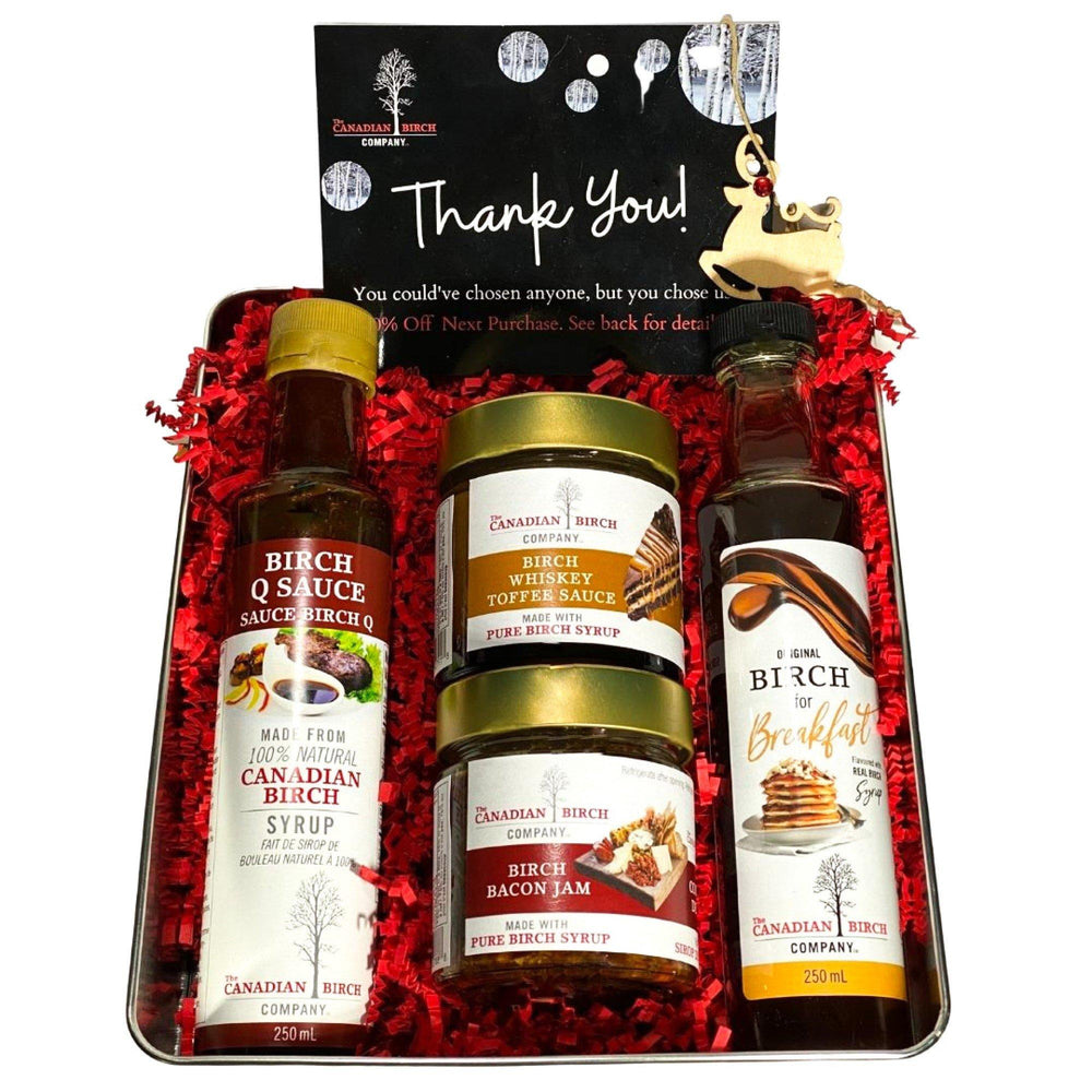 The Big Birch Sauces & Condiments The Canadian Birch Company Full Size 212 - 250 ml . A thank you note and coupon from The Canadian Birch Company is included as well as a wooden holiday tree ornament.
